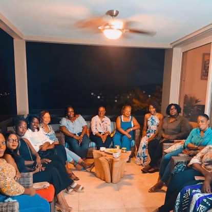 CIWiL AB women seated on a balcony at an evening gathering.