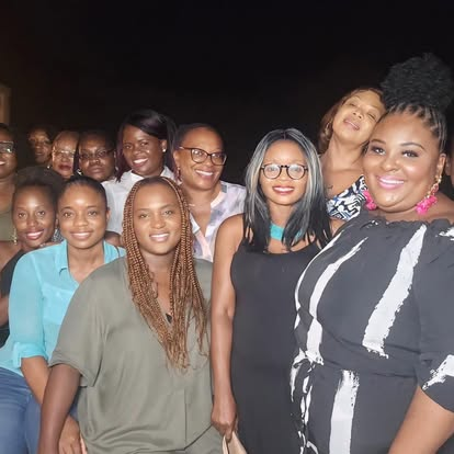 Group of CIWiL AB women smiling together at a night event.