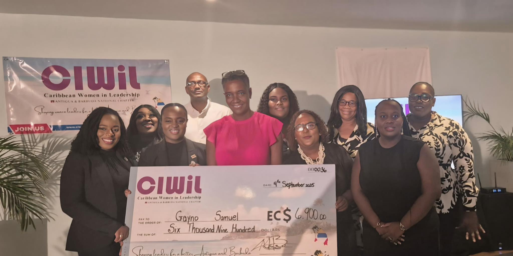 Gayno Samuel receiving the 2025 CIWiL AB Fempreneur Fund award cheque of EC$6,900 alongside CIWiL AB members and executives.