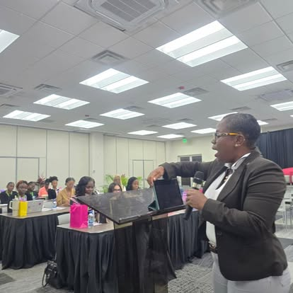 YWiL AB 2026 Cohort facilitator presenting at a lectern