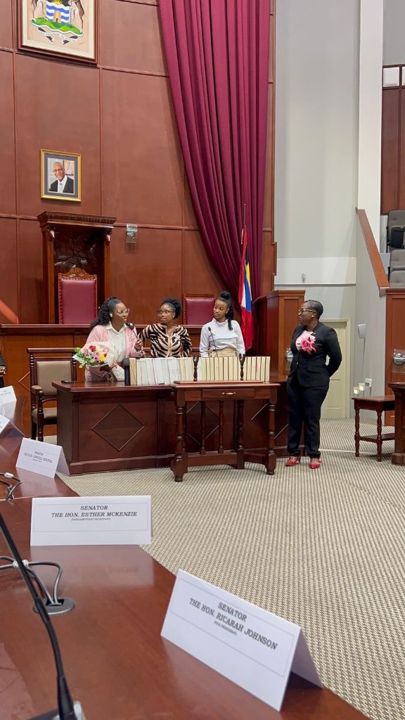 YWiL AB members at the Parliament Speaker's desk with the President of the Senate